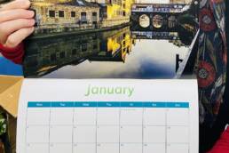 Genesis Trust 2021 calendar open at the month January, showing image of Bath waterways