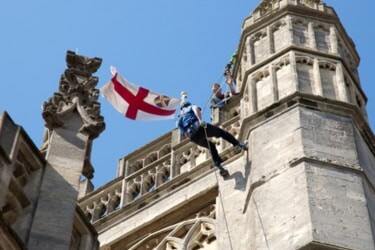 Man abseiling down Bath Abbey