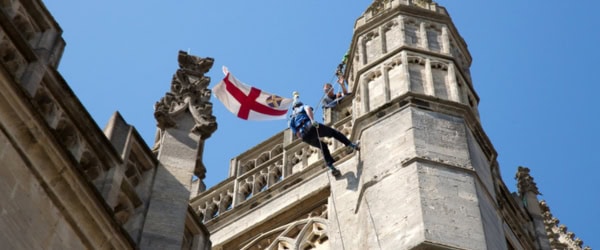 Man abseiling down Bath Abbey