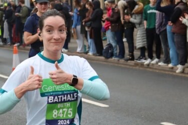 Lady running the Bath Half for Genesis Trust