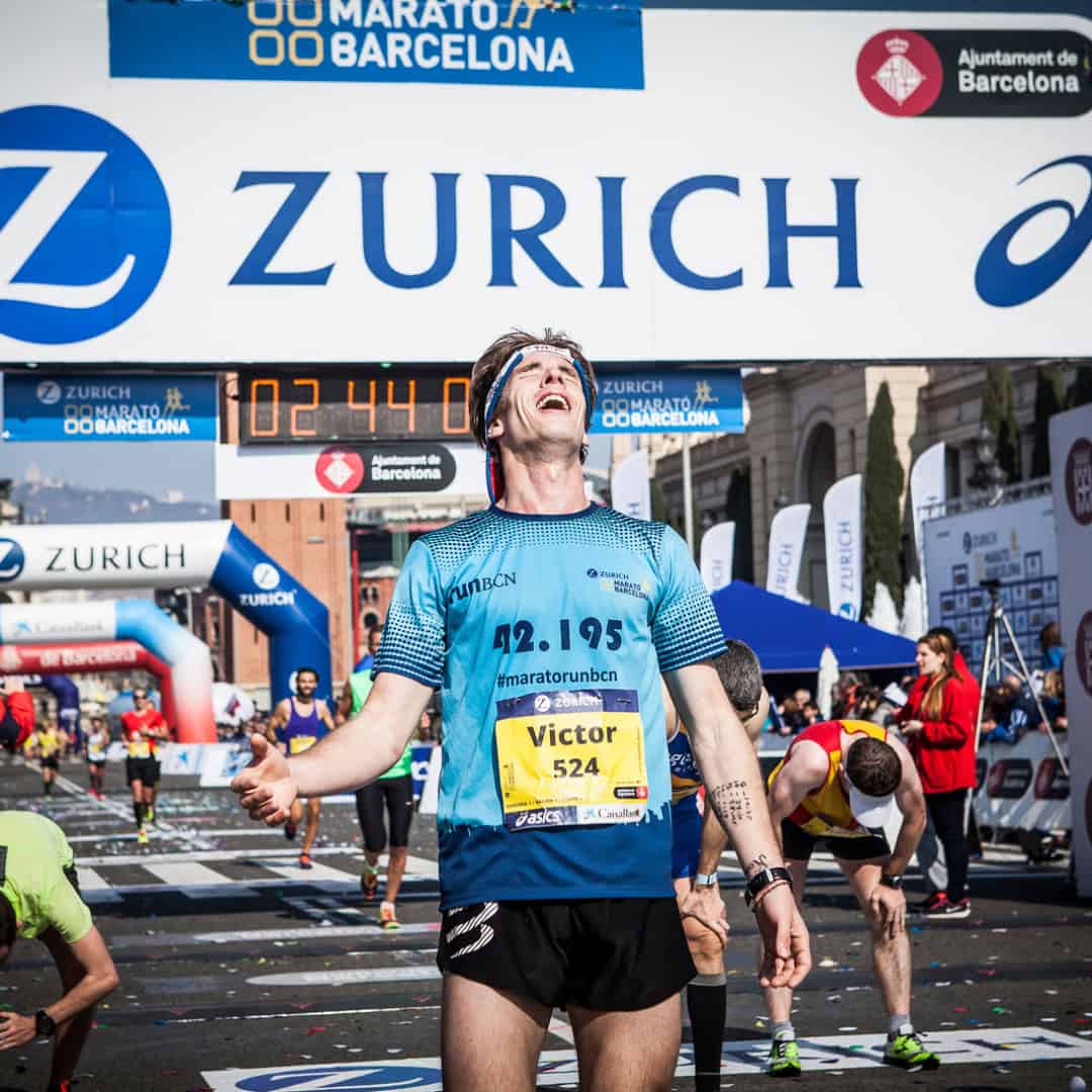 man celebrating at the finish line