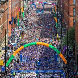 A large crowd of runners at the starting line in Manchester.