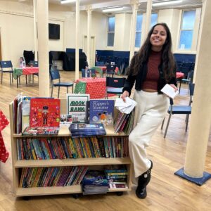 Lady from Toppings Bookshop donating vouchers for books