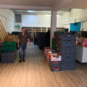 John Stauber standing in the new Foodbank warehouse